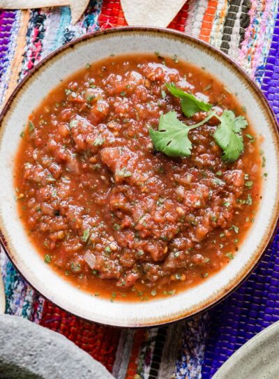 blender salsa in bowl with cilantro