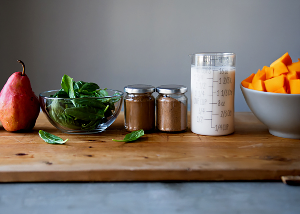 Butternut squash smoothie ingredients on counter.