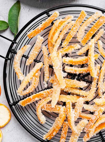 Candied orange peel recipe on a black wire basket