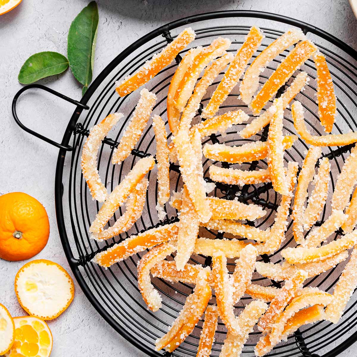 Candied orange peel recipe on a black wire basket