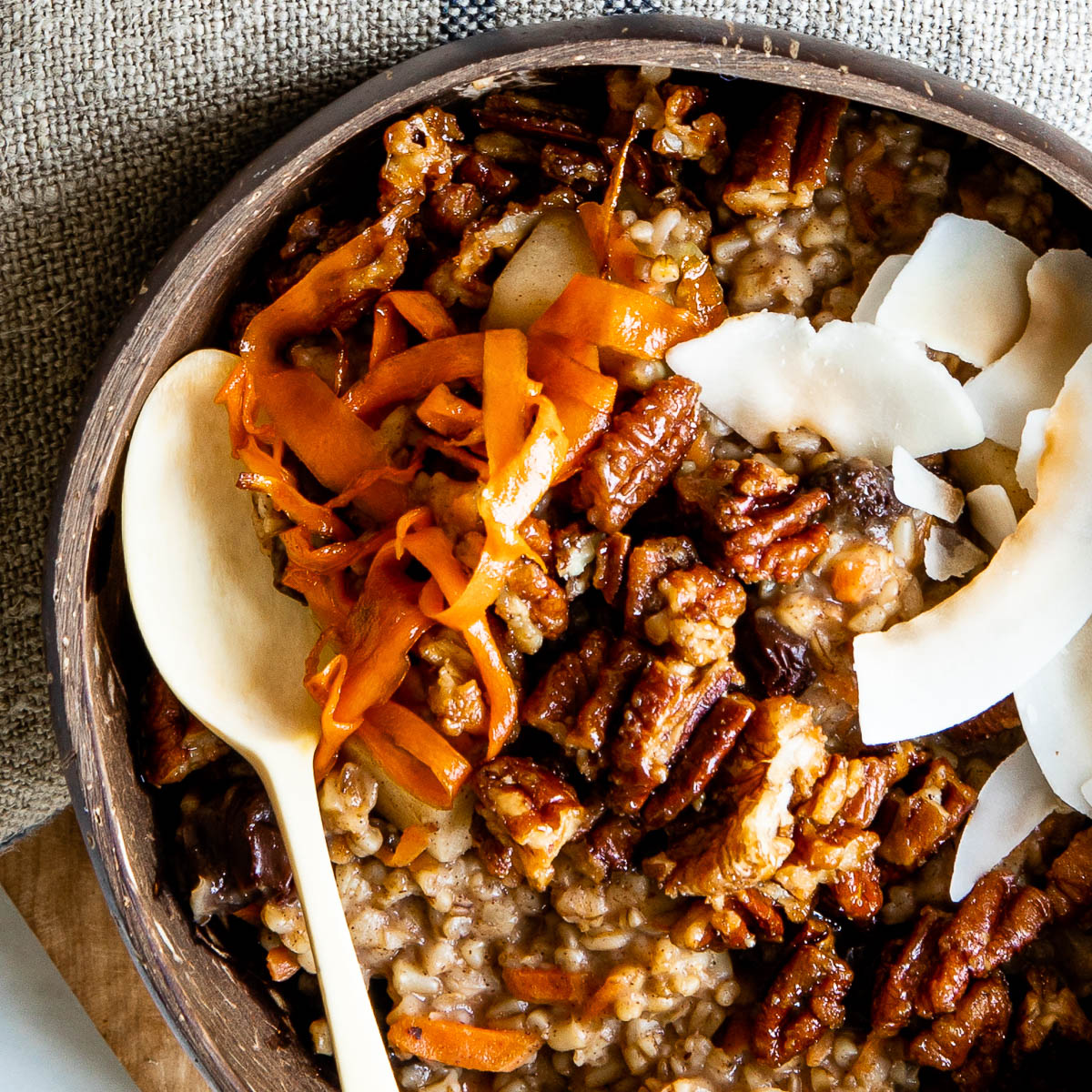 Spoon in a bowl of carrot cake oatmeal.