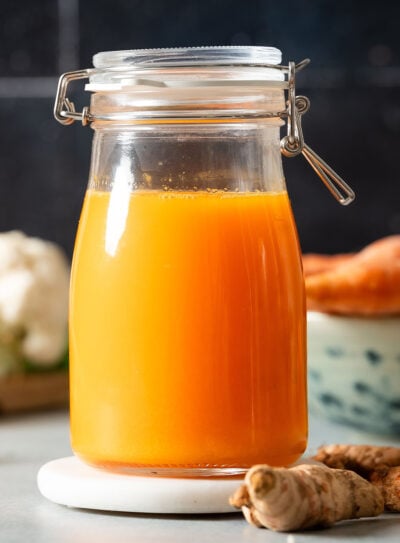 Fresh carrot turmeric juice in a glass