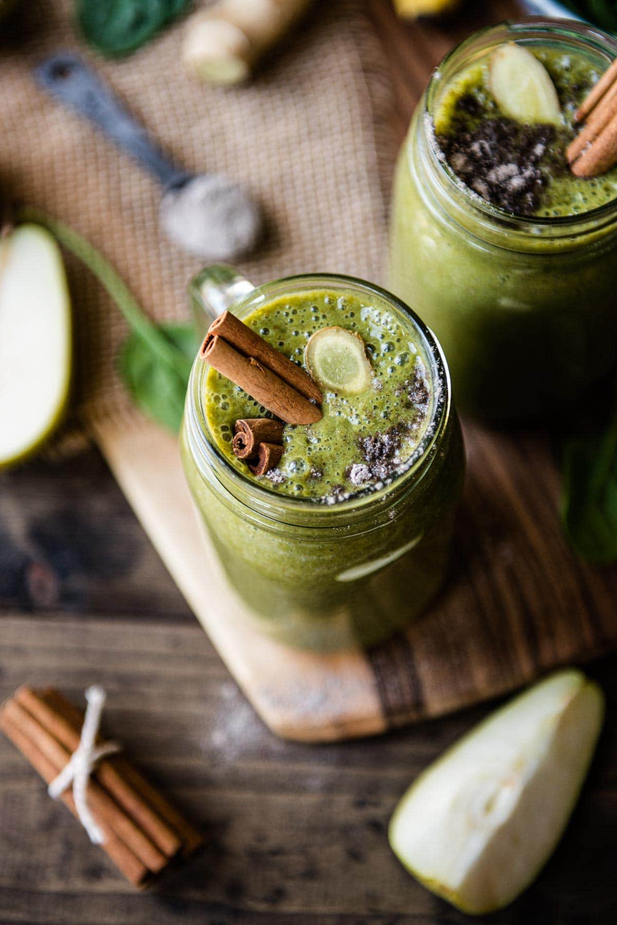 A warm chai smoothie topped with cinnamon sticks and ready to drink. 