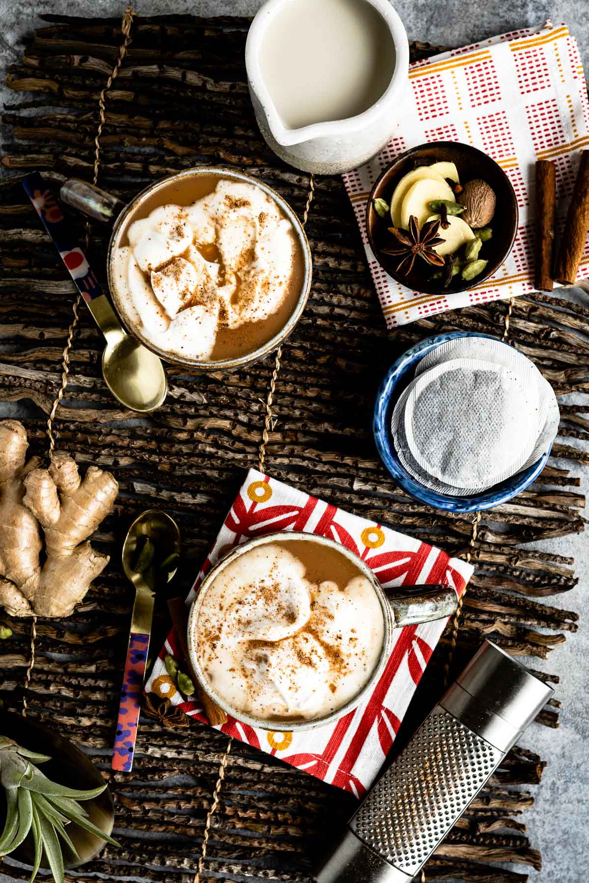 A steamy mug of chai tea latte topped with frothy coconut cream