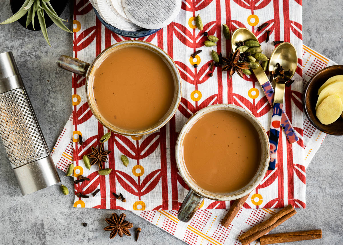 Two cups of chai tea latte on a table