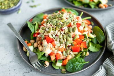 Chickpea salad with red peppers and pepitas.