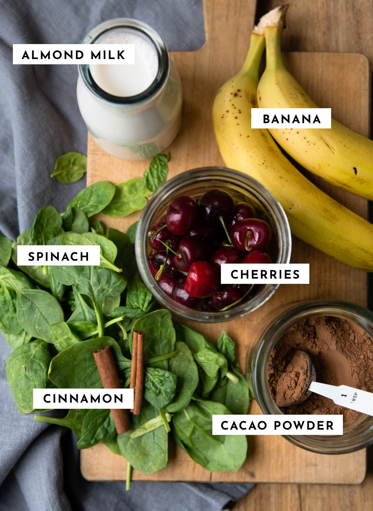 Labeled ingredients for making a chocolate cherry smoothie.