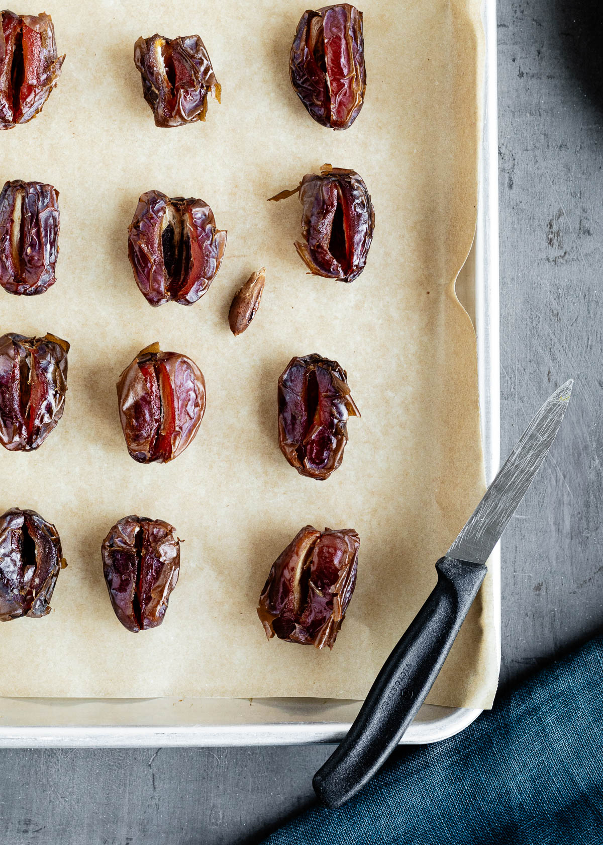 A dozen Medjool dates pitted for a chocolate covered dates recipe.