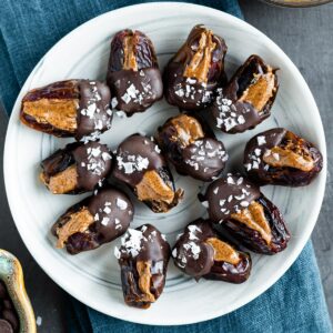 Quick and healthy chocolate covered dates on a plate.