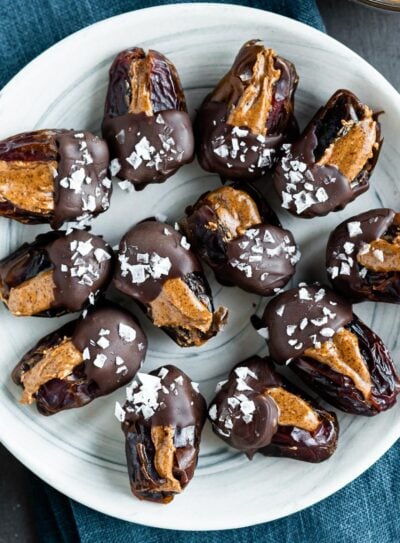 Quick and healthy chocolate covered dates on a plate.