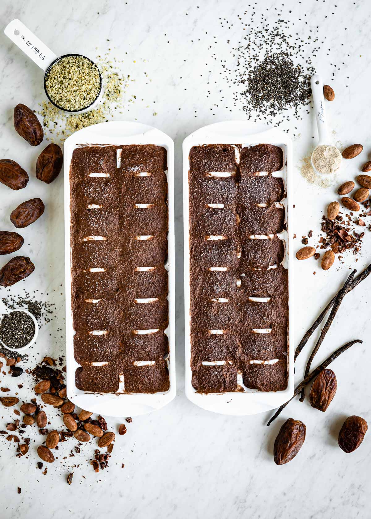 Frozen smoothie cubes in two ice cube trays.