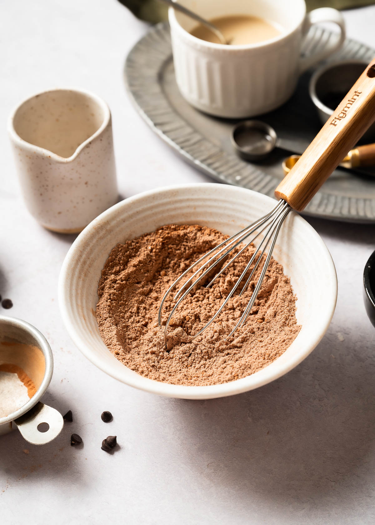 Dry ingredients being whisked into a vegan chocolate mug cake.