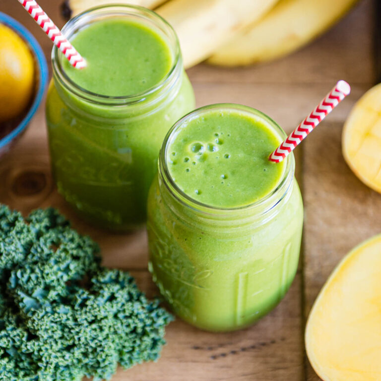 cleansing citrus smoothies in glass jars with paper straws.