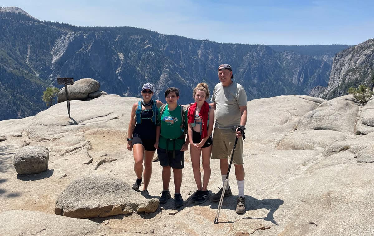 Jen and family hiking upper falls in yosemite.