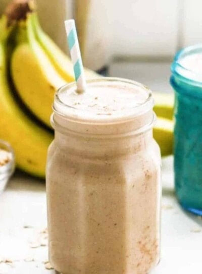 Dairy-free banana smoothie in a glass jar with straw.