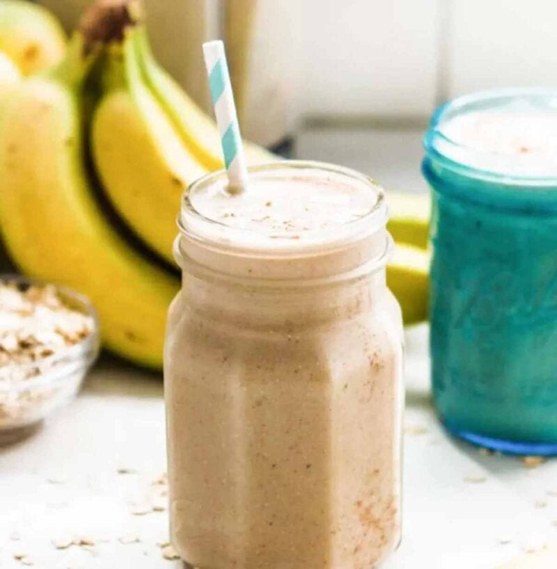Dairy-free banana smoothie in a glass jar with straw.