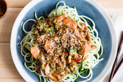 Zucchini noodles on plate with almond butter sauce