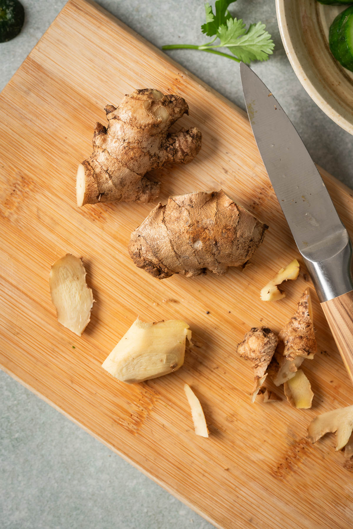 Peeled ginger on a cutting board