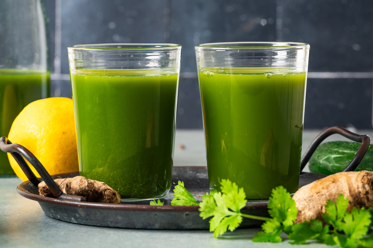 Two glasses of detox green juice ready to drink