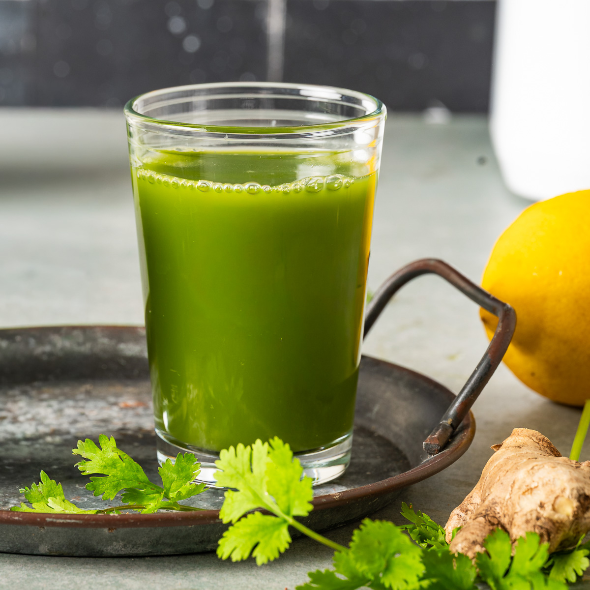 A glass of detox green juice