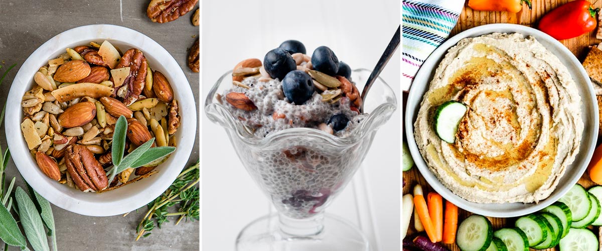 3 snack recipes including a savory trail mix with nuts and seeds, chia pudding in an ice cream dish topped with almonds and blueberries and a homemade hummus surrounded by fresh veggies.
