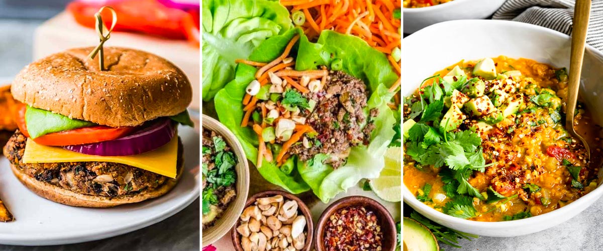 black bean burgers on a white plate with a toothpick through the top next to a plate of Thai lettuce wraps next to a bowl of yellow lentils topped with avocado and cilantro.