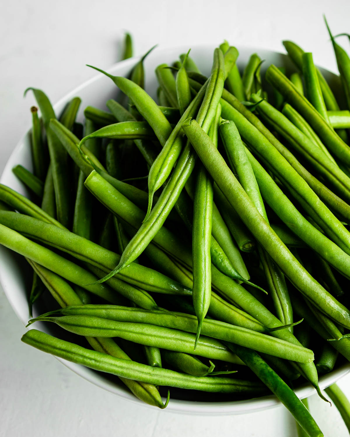 big bowl of fresh green beans.
