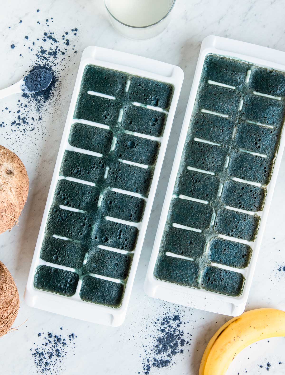 Two ice trays filled with freshly frozen natural electrolyte smoothie cubes