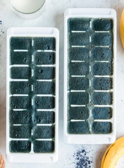 Two ice trays filled with freshly frozen natural electrolyte smoothie cubes