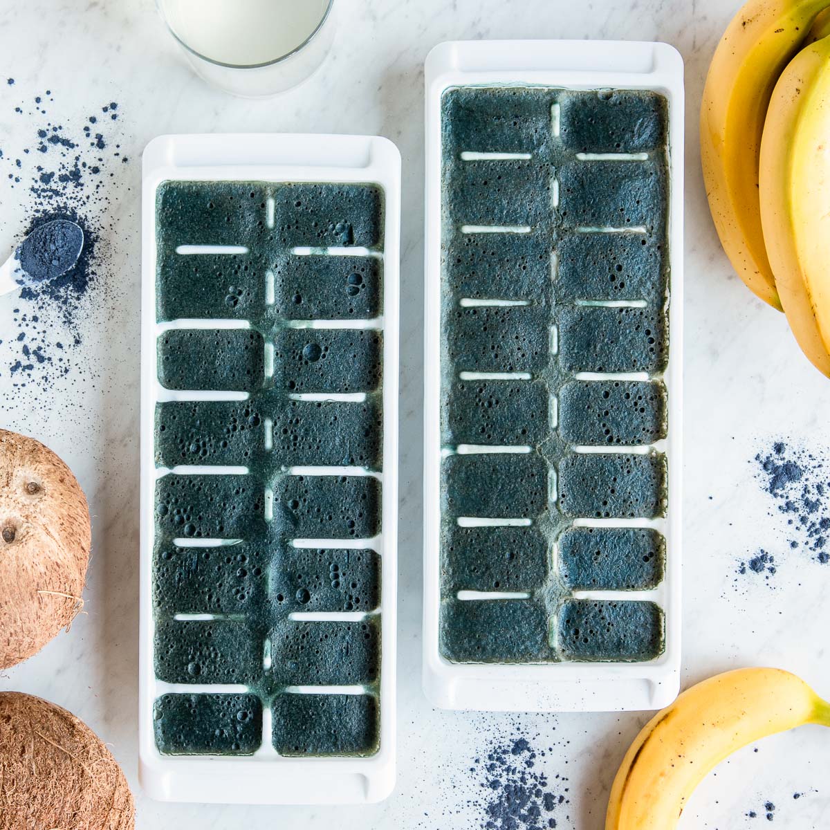 Two ice trays filled with freshly frozen natural electrolyte smoothie cubes