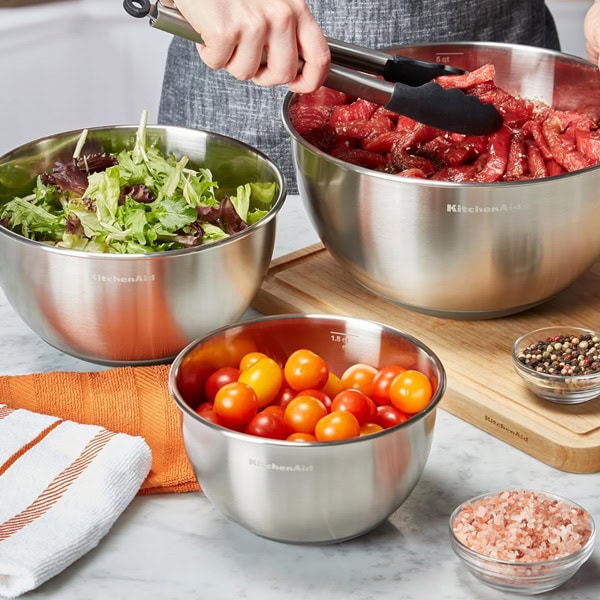 Fresh salad, cherry tomatoes, and ingredients for healthy smoothies.