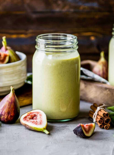 Fig smoothie recipe on table with fresh figs.