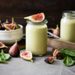 Fig smoothie recipe on table with fresh figs.