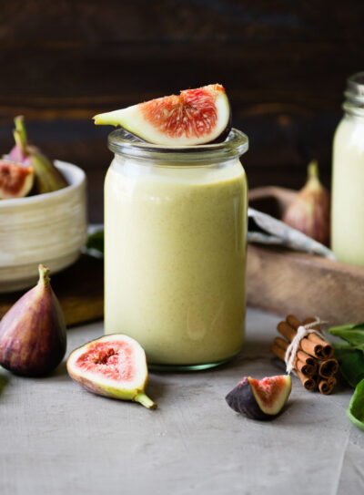 Fig smoothie recipe on table with fresh figs.