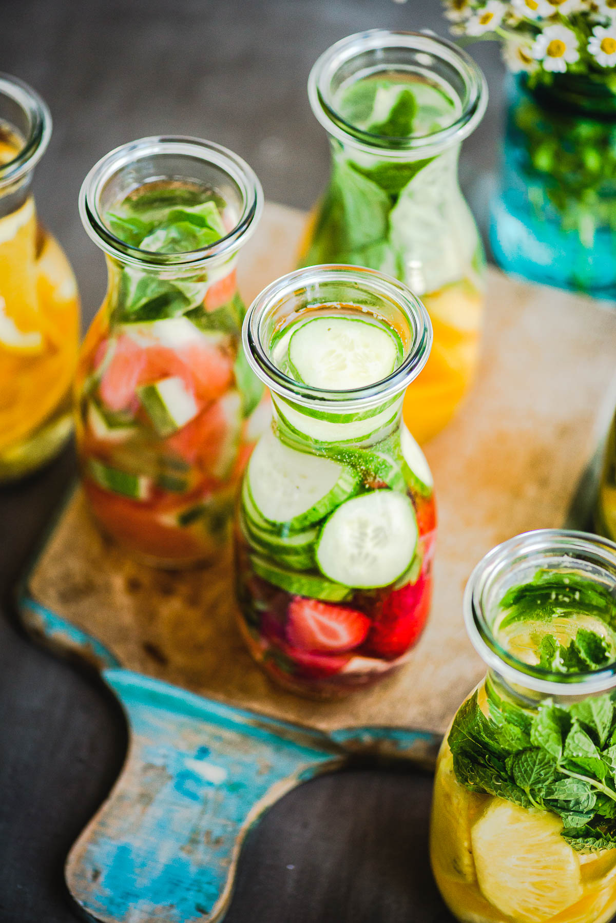 several glass containers for fruit-infused water.