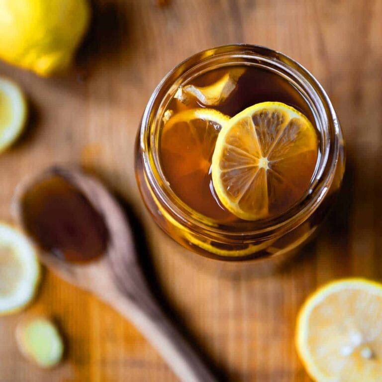 All natural ginger honey lemon tea cough remedy in a glass jar.