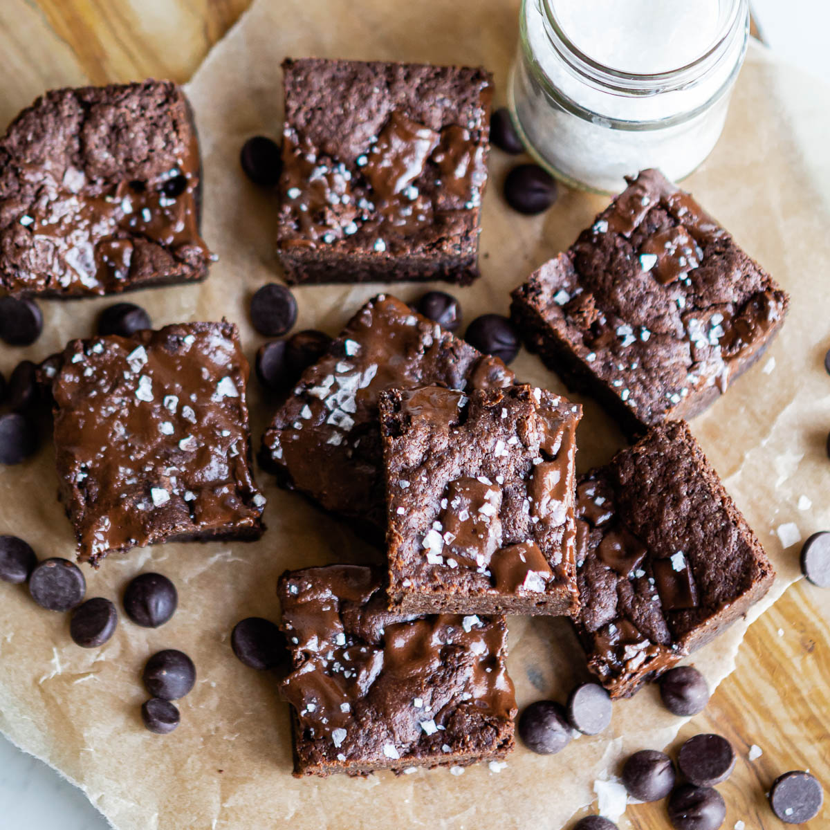 chocolate dessert without dairy or gluten cut into squares and topped with sea salt and chocolate chips