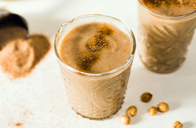 Caramel protein shake in a glass.