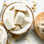 Frozen smoothie cubes in a halved coconut.