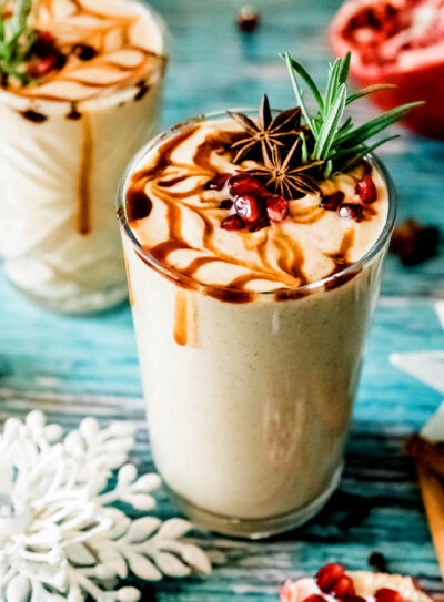 Glass of gingerbread smoothie recipe with festive toppings.