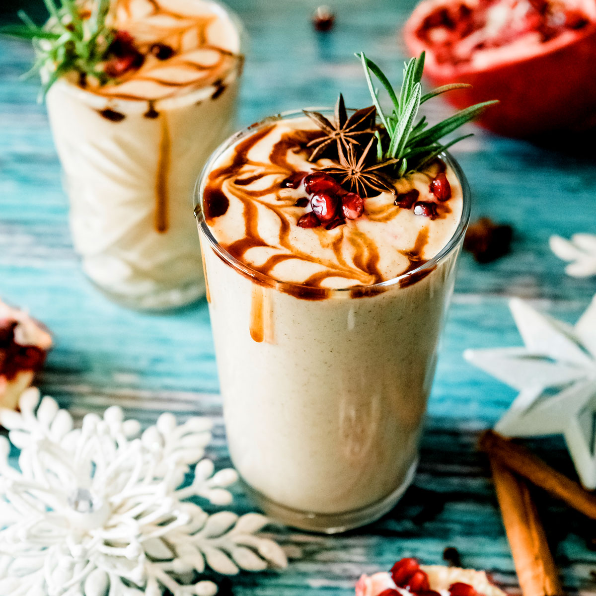 Glass of gingerbread smoothie recipe with festive toppings.