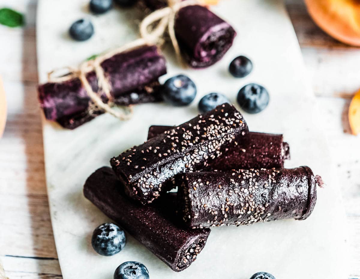 homemade fruit roll ups with chia seeds turned purple from elderberry syrup