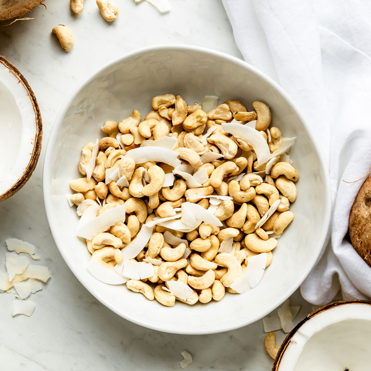 Bowl of cashews to blend into vanilla protein shake recipe.