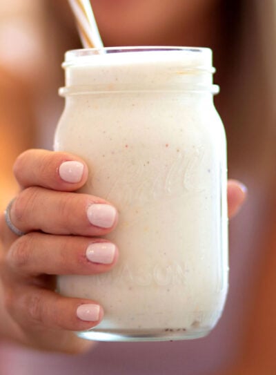 Glass with healthy vanilla protein shake recipe in it.