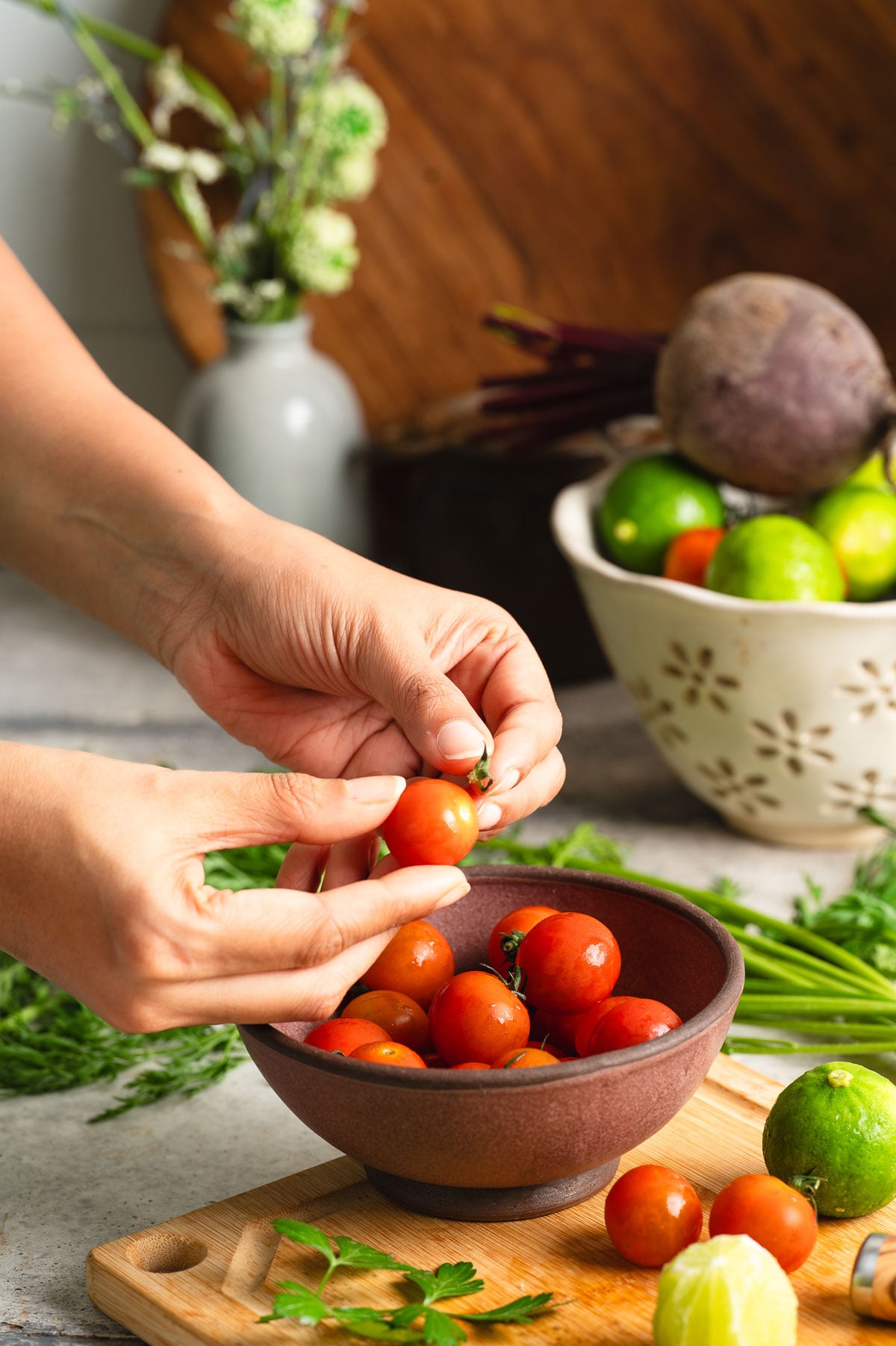 Removing leaf tops from the cherry tomatoes