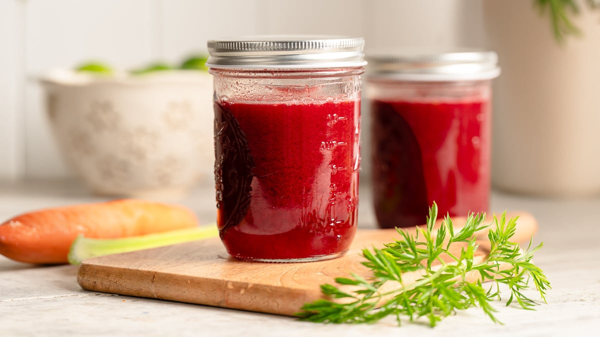 Two mason jars of homemade V8 juice ready to enjoy