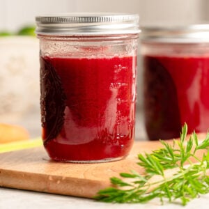 Two mason jars of homemade V8 juice on the counter