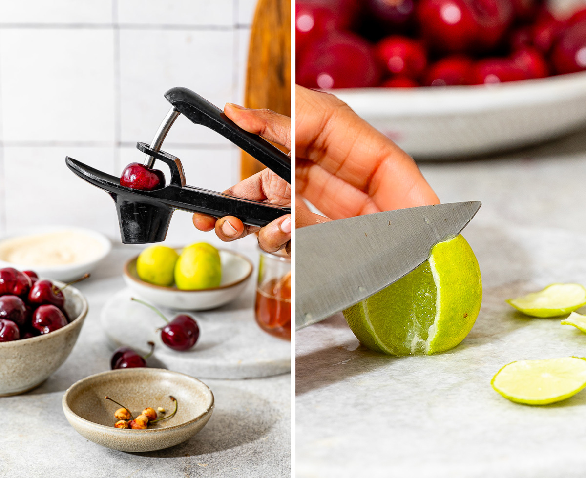 A close-up shot of a hand using a black cherry pitter to remove the pit from a fresh cherry.
