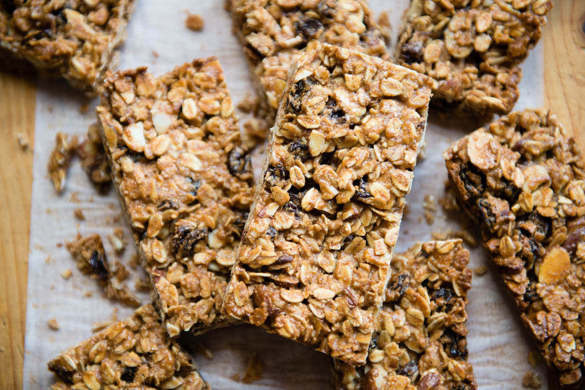 stack of oatmeal raisin bars on parchment paper.
