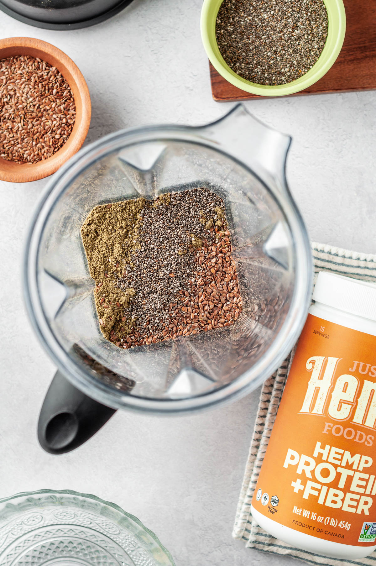 Overheat shot of flax, chia and hemp in blender to make protein powder recipe.